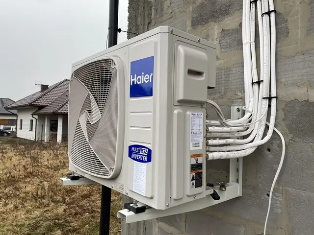 Air conditioning outdoor unit next to a building