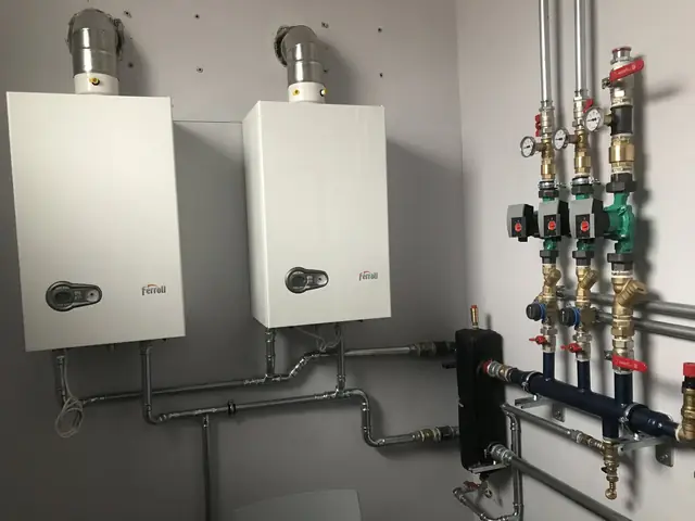 Two wall-hung boilers with a manifold