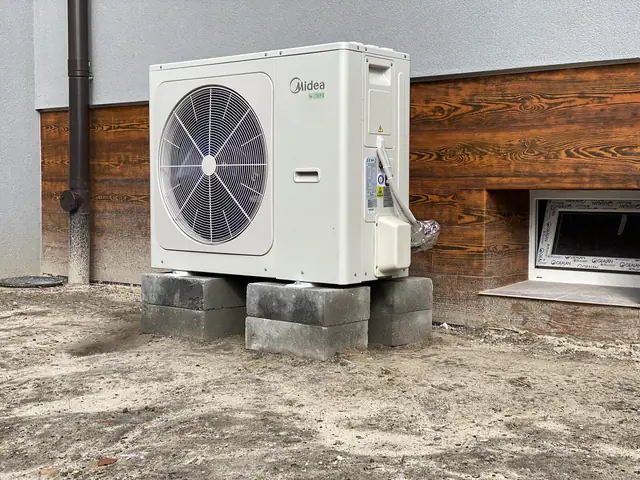 Heat pump next to a building
