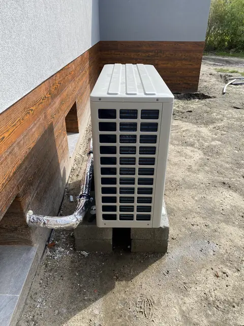 Heat pump next to a building