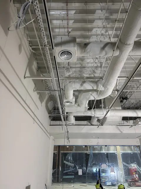 Large ventilation ducts below the ceiling